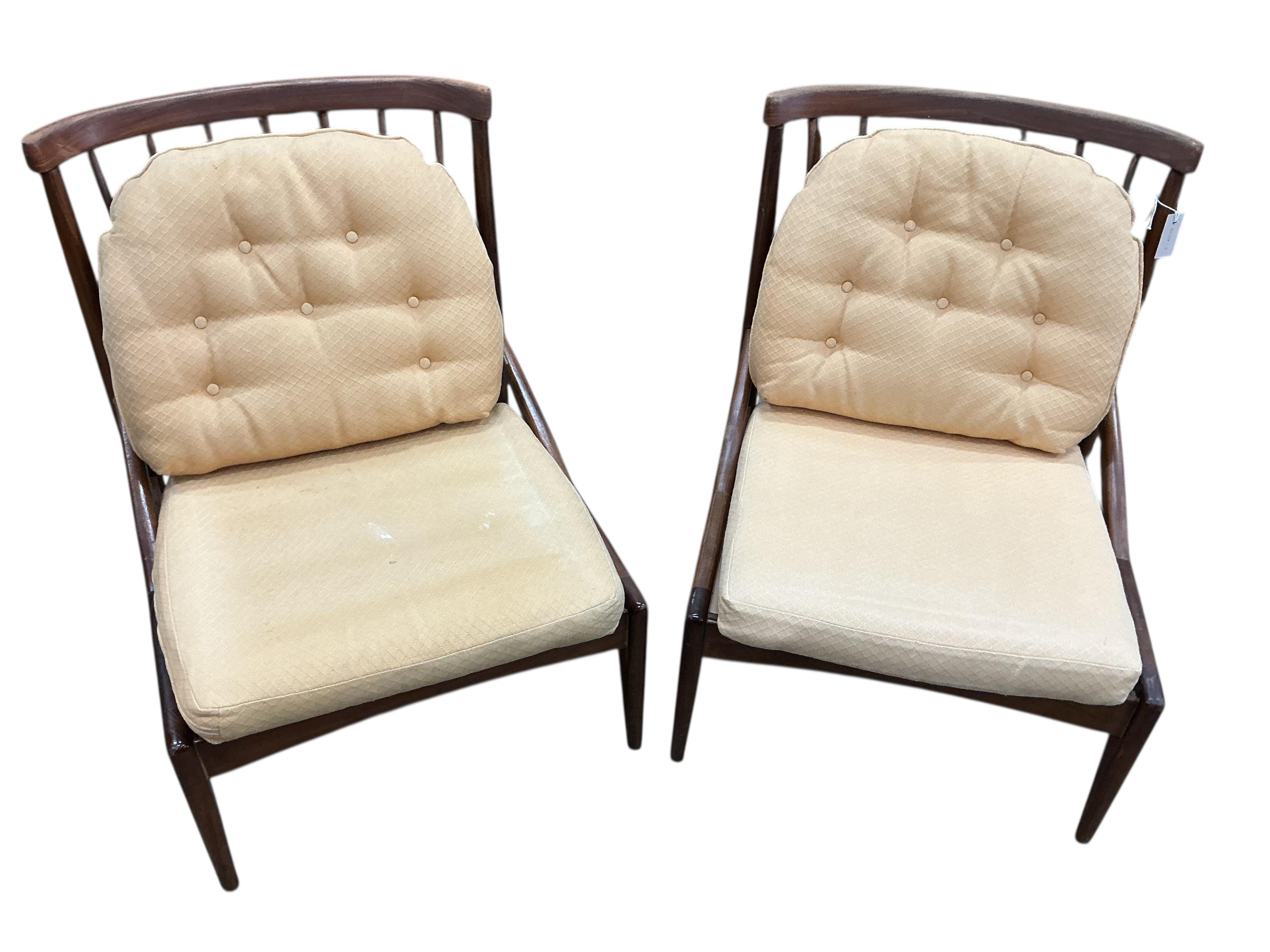 Greaves and Thomas: A pair of mid century stick back armchairs, width 64cm, depth 64cm, height 80cm